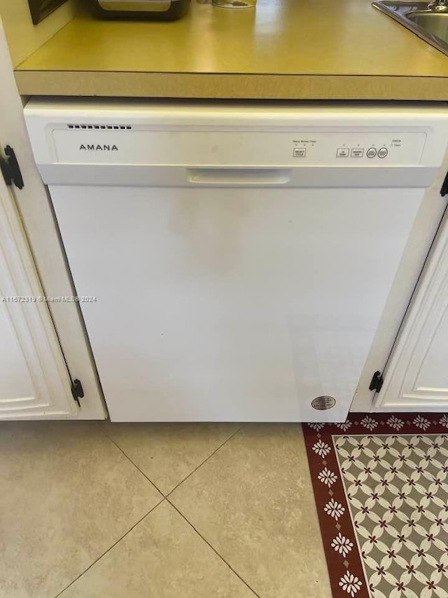 details featuring white cabinets and dishwasher