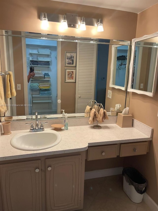 bathroom with tile patterned flooring and vanity