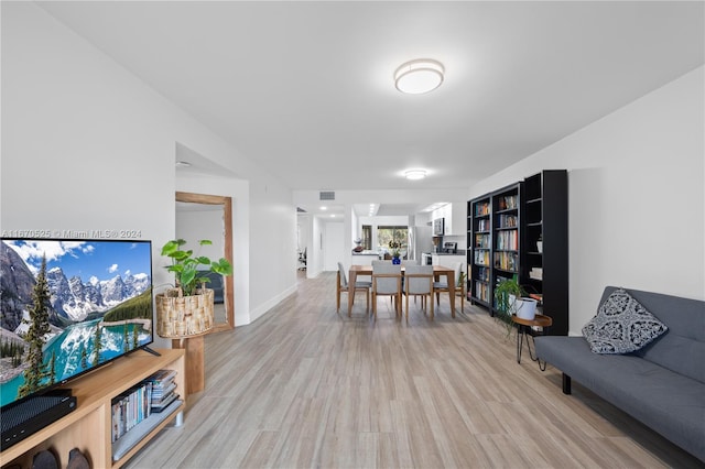 living room with light hardwood / wood-style flooring