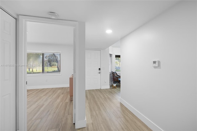 corridor featuring light hardwood / wood-style floors