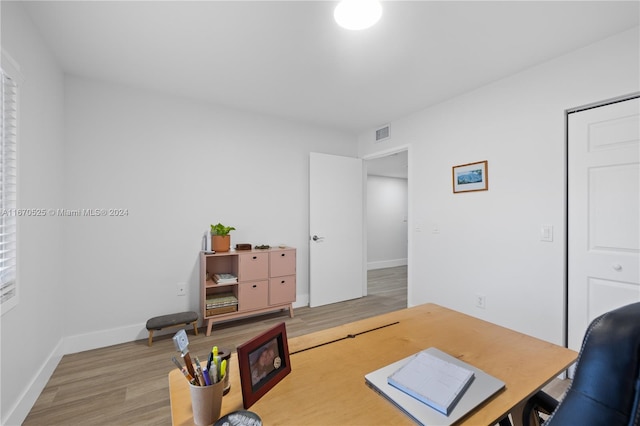 office with hardwood / wood-style flooring