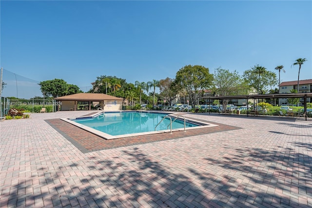 view of swimming pool with a patio area