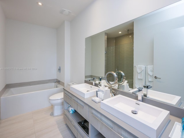 full bathroom featuring separate shower and tub, vanity, toilet, and tile patterned floors