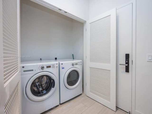 washroom featuring independent washer and dryer