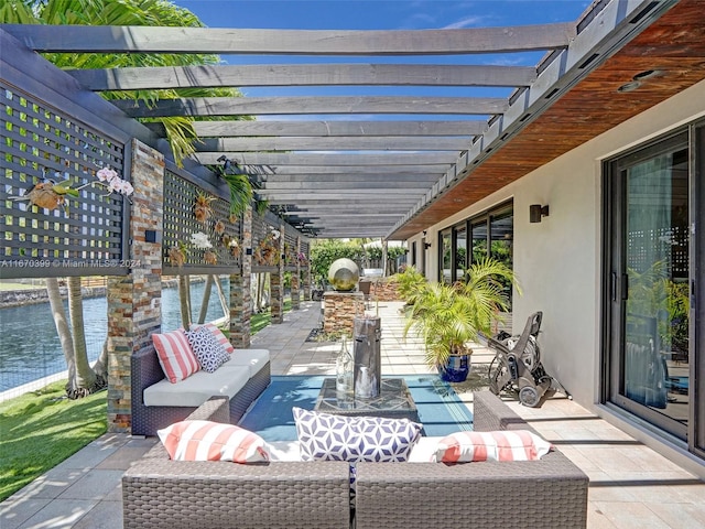 view of patio / terrace featuring a pergola, outdoor lounge area, and a water view