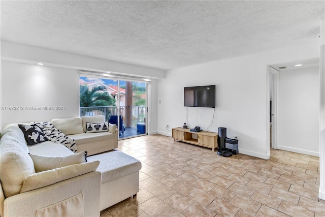 living room featuring a textured ceiling