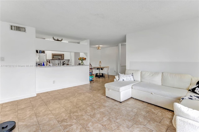 living room with a textured ceiling