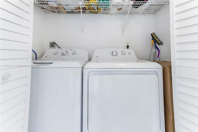 laundry area featuring washing machine and clothes dryer