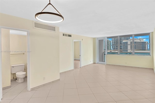 spare room with light tile patterned floors