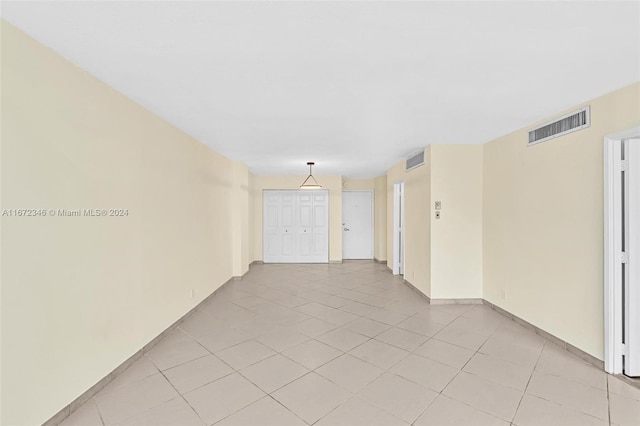 unfurnished room with light tile patterned floors