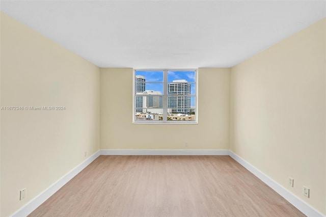 spare room featuring light hardwood / wood-style flooring