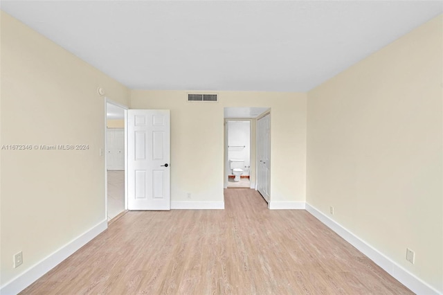 spare room with light wood-type flooring