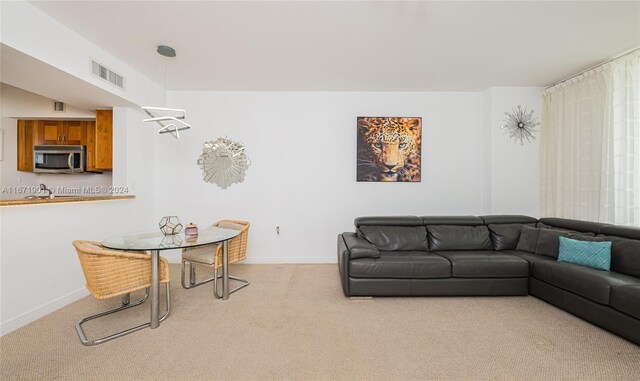 1745 E Hallandale Beach Blvd Unit 1804W, Hallandale Beach, FL 33009 - living room with visible vents, carpet flooring, and baseboards