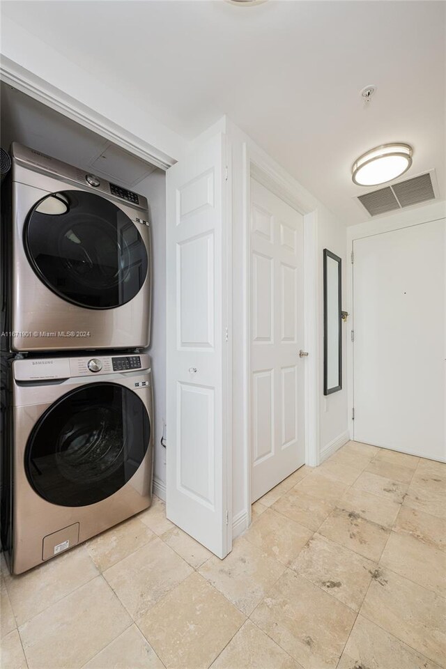 1745 E Hallandale Beach Blvd Unit 1804W, Hallandale Beach, FL 33009 - laundry room with laundry area, stacked washer / drying machine, and visible vents