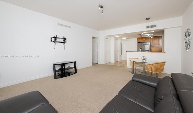 living room featuring light colored carpet