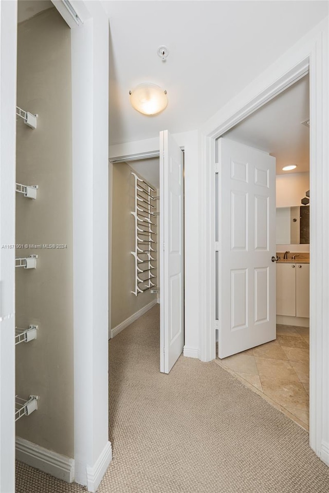 1745 E Hallandale Beach Blvd Unit 1804W, Hallandale Beach, FL 33009 - hall featuring baseboards, light carpet, and a sink