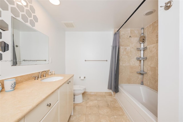 full bathroom with shower / tub combo with curtain, vanity, toilet, and tile patterned floors