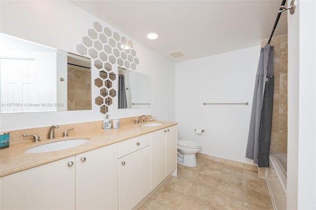 full bathroom featuring shower / tub combo, tile patterned floors, vanity, and toilet