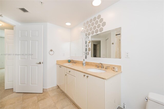1745 E Hallandale Beach Blvd Unit 1804W, Hallandale Beach, FL 33009 - full bathroom with a sink, toilet, double vanity, and visible vents