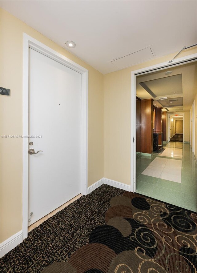 1745 E Hallandale Beach Blvd Unit 1804W, Hallandale Beach, FL 33009 - corridor featuring baseboards, attic access, carpet floors, and recessed lighting