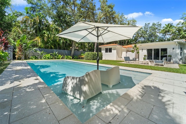 view of swimming pool with a patio area