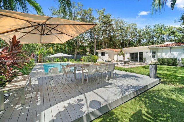 wooden deck with a lawn