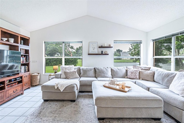 tiled living room with a textured ceiling and lofted ceiling