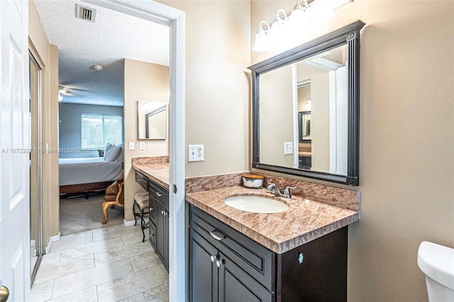 2913 Myrtle Oak Cir, Davie, FL 33328 - bathroom with vanity, ensuite bath, tile patterned floors, and a textured ceiling