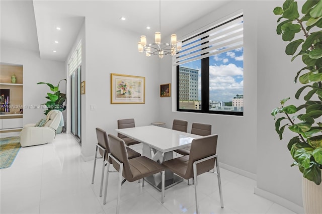 dining area with a notable chandelier and light tile patterned floors