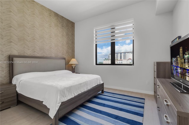 bedroom with light hardwood / wood-style floors