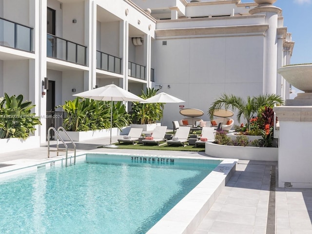 view of pool featuring a patio