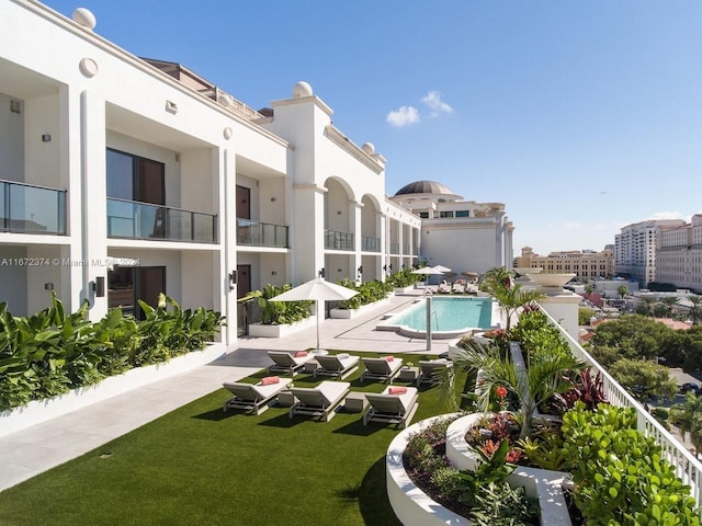 view of pool featuring a yard and a patio area