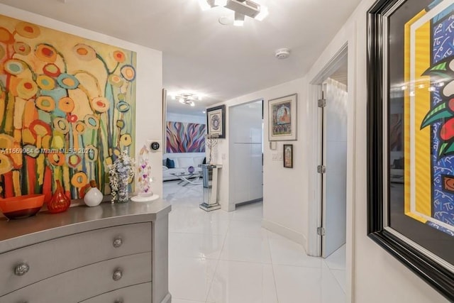 hallway with light tile patterned floors