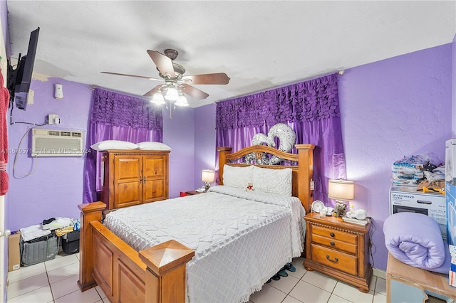 tiled bedroom featuring ceiling fan and a wall unit AC