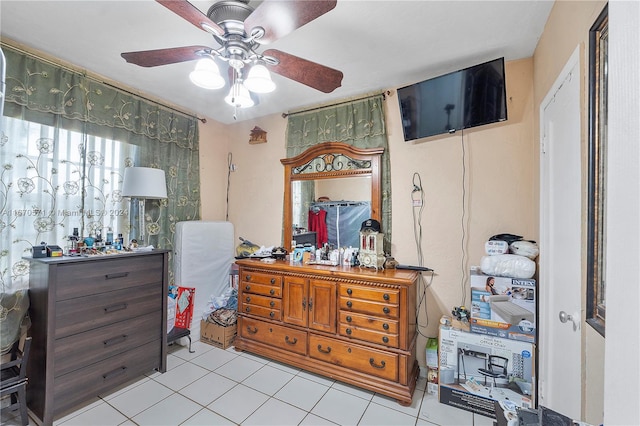 tiled bedroom with ceiling fan