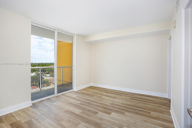 empty room with light hardwood / wood-style floors