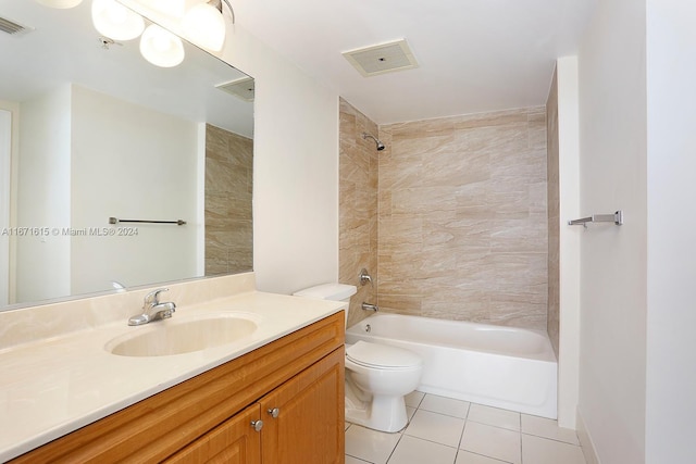 full bathroom featuring vanity, tiled shower / bath combo, toilet, and tile patterned floors