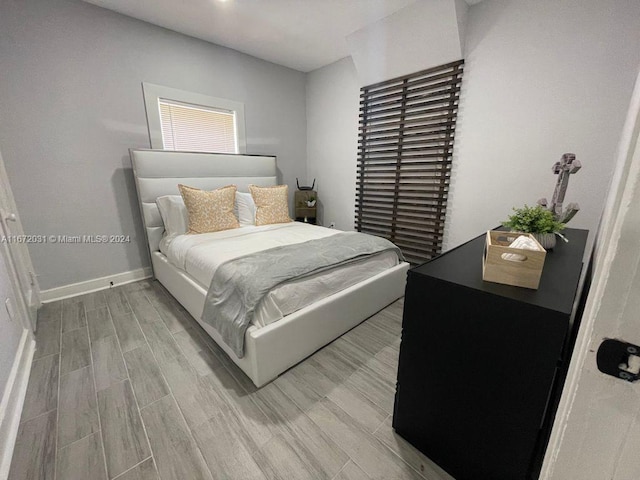 bedroom with light hardwood / wood-style floors