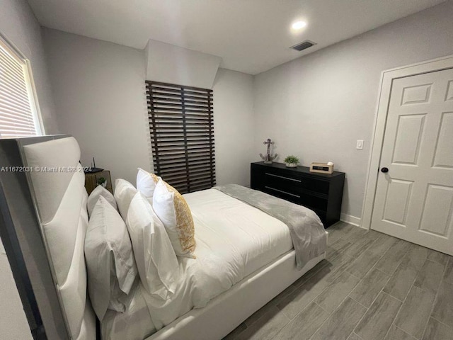 bedroom featuring light hardwood / wood-style floors