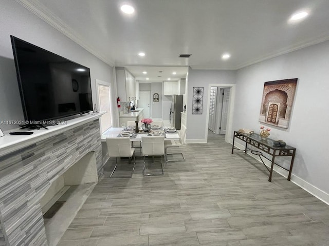 dining area with crown molding