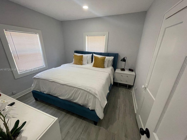 bedroom featuring dark hardwood / wood-style flooring