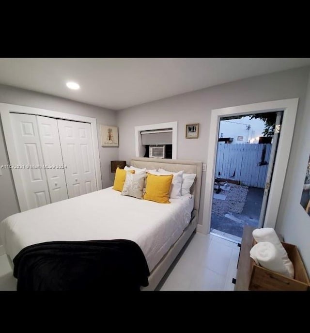 tiled bedroom featuring a closet