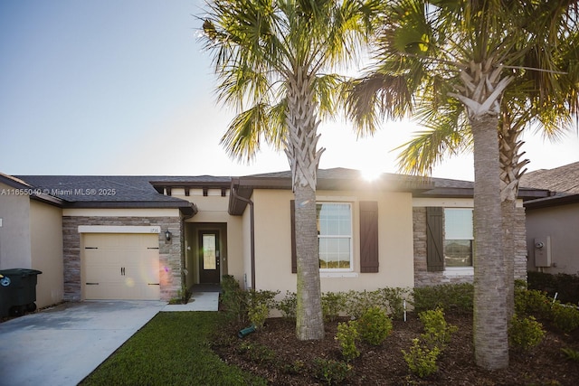 view of front of home with a garage and a front yard