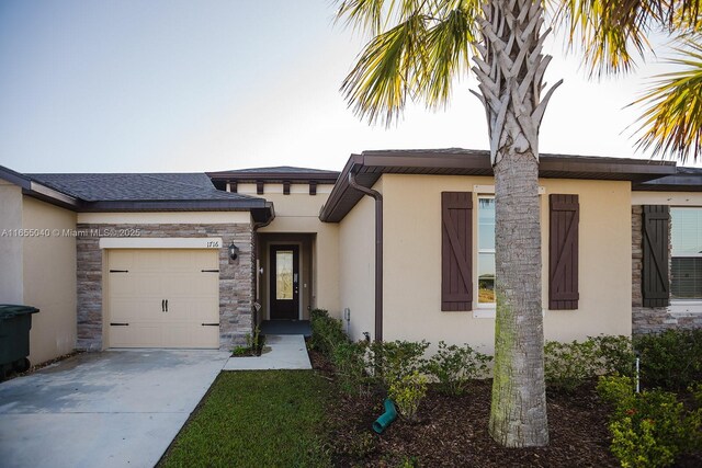 view of front of home with a garage and a front lawn