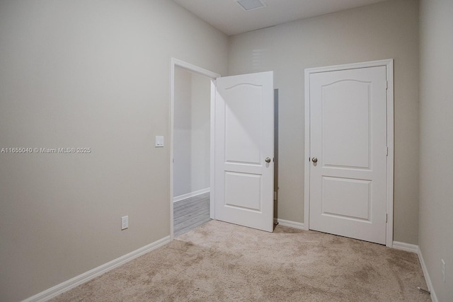 garage with a garage door opener, electric panel, and electric water heater