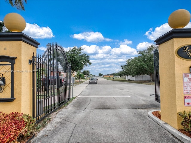 view of road featuring a gate