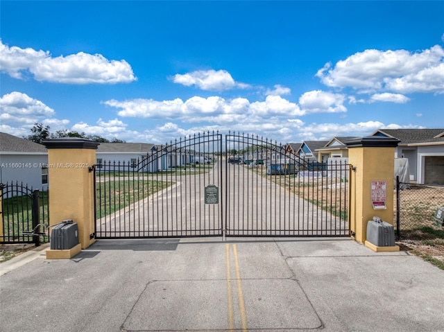 view of gate featuring a residential view