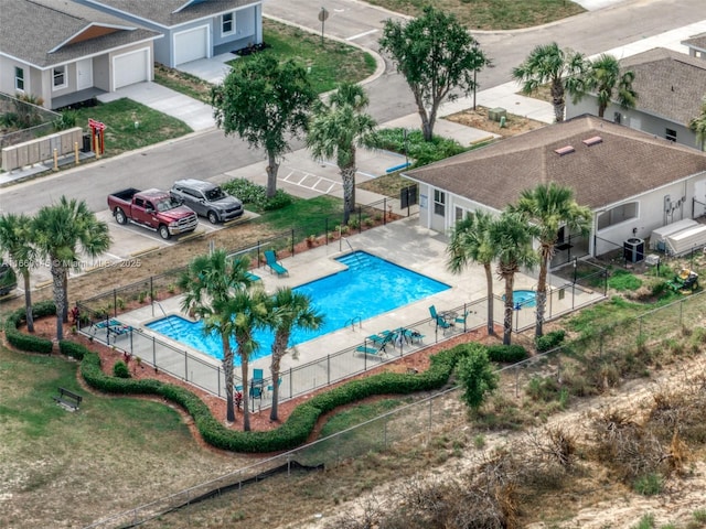 pool featuring fence and a patio