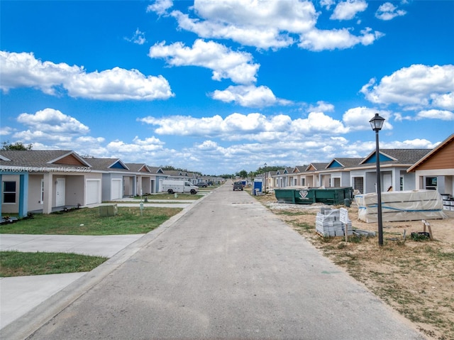 view of street featuring street lighting and a residential view