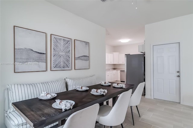 dining area with light wood-type flooring